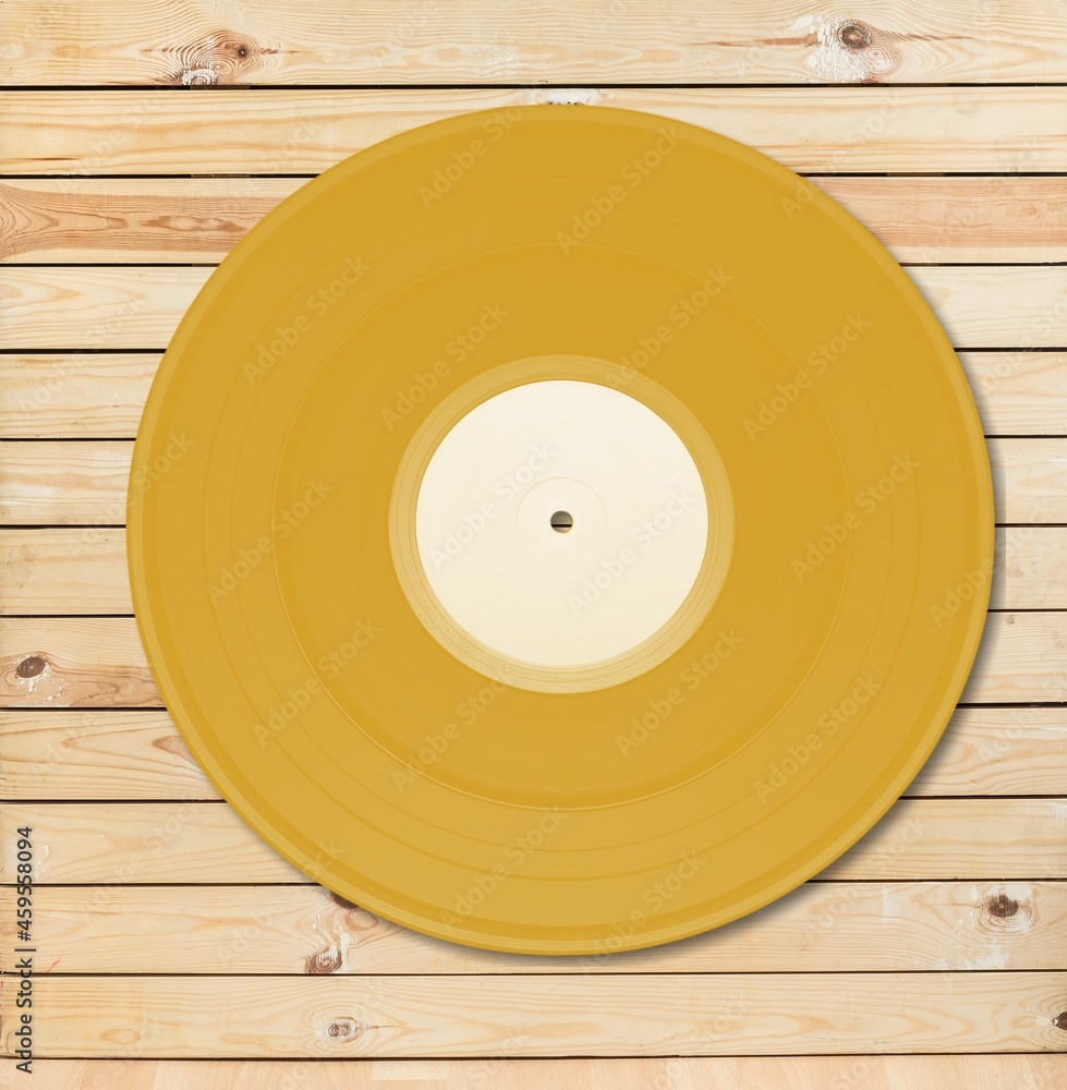 Golden vinyl record design element on the background