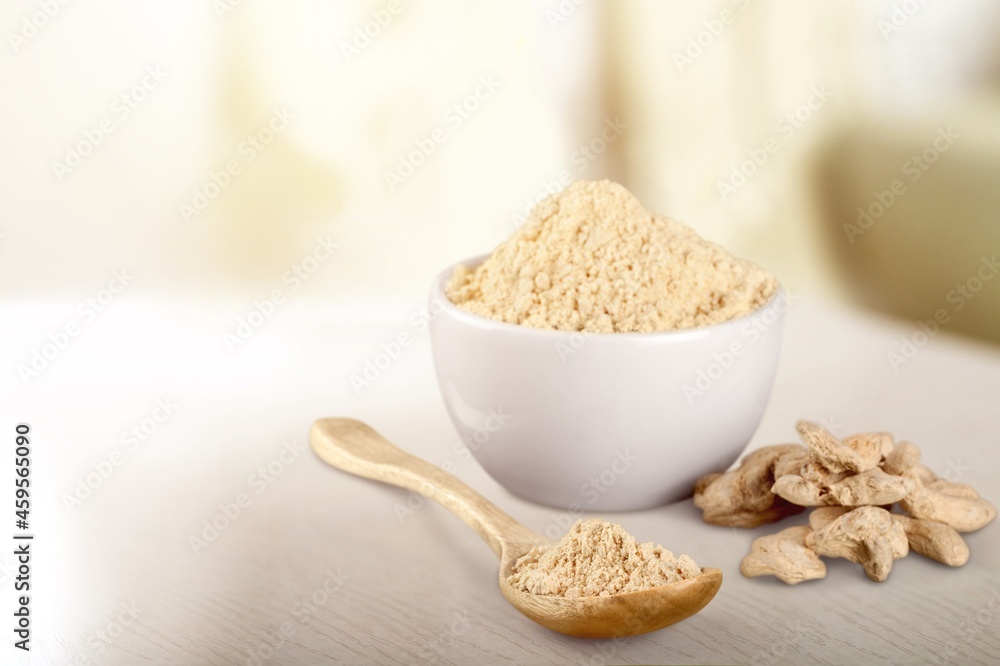 Fingerroot with finger root herbal powder in ceramic mortar on the desk