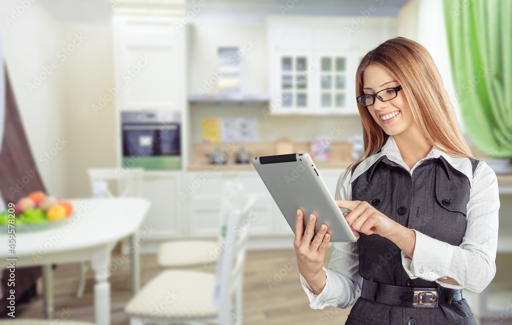 Opening small business. Happy woman holding digital tablet