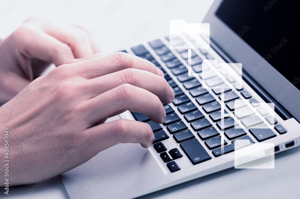 Document Management System, a consultant working on laptop computer in the office.