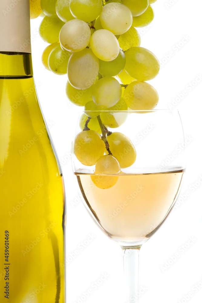 White wine grapes bottle and wineglass