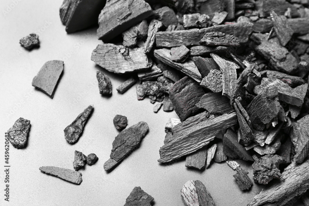 Heap of charcoal on white background, closeup