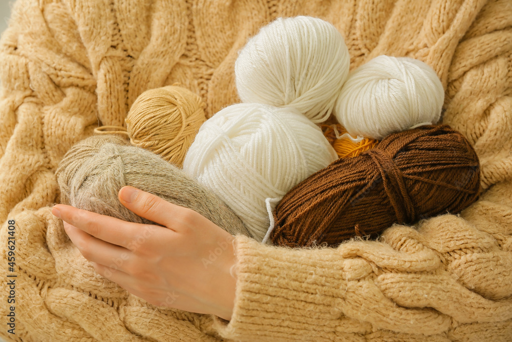 Woman with knitting yarn, closeup