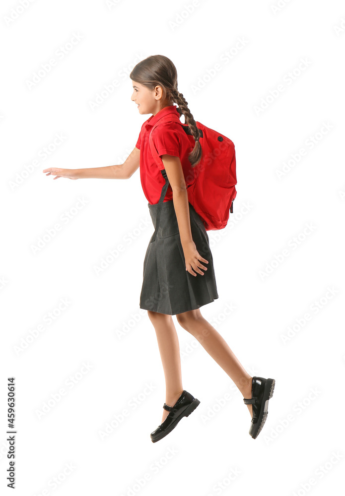 Jumping schoolgirl on white background