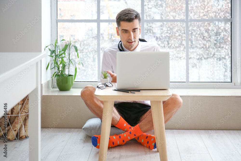 Young businessman working at home