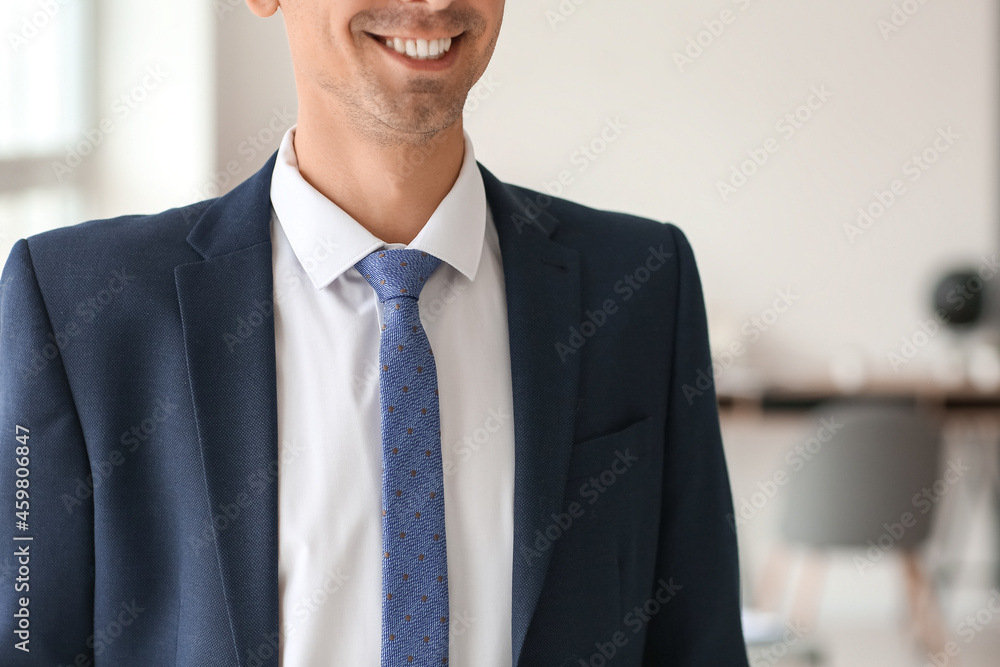 Young man in stylish suit at home