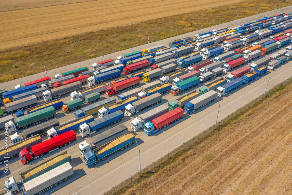 Trucks in line at the loading terminal. Transportation of goods by cars.