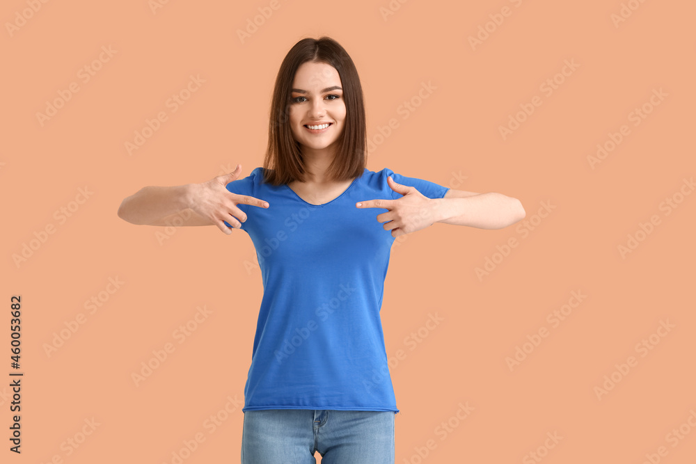 Young woman in modern t-shirt on color background