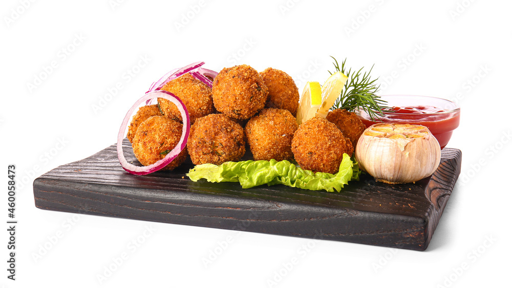 Board with tasty cod cutlets and sauce on white background