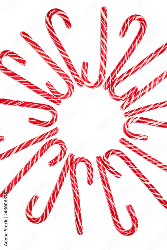 Frame made of candy canes on white background