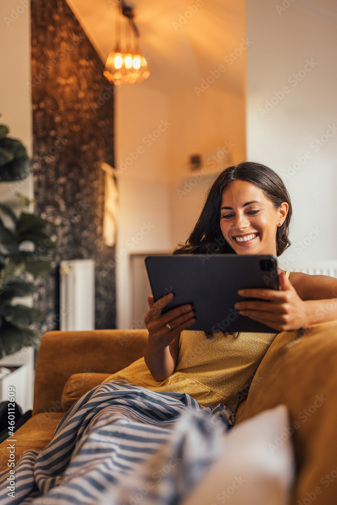 Adult woman, staying in touch with the news.