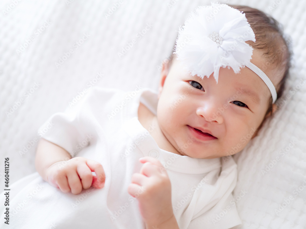 Close up happy smile and laugh face of  Asian adorable baby infant girl , a baby happy time family c