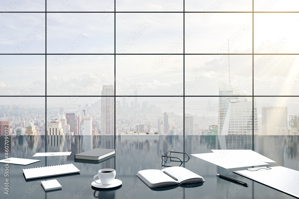 Gray office mood with supplies and coffee cup on desk top. City view background. 3D Rendering.