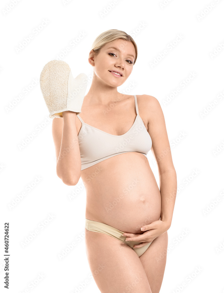 Beautiful pregnant young woman with massage mitten on white background