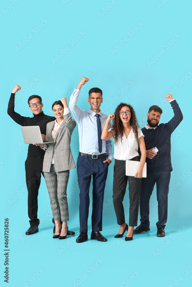 Happy young business people on blue background