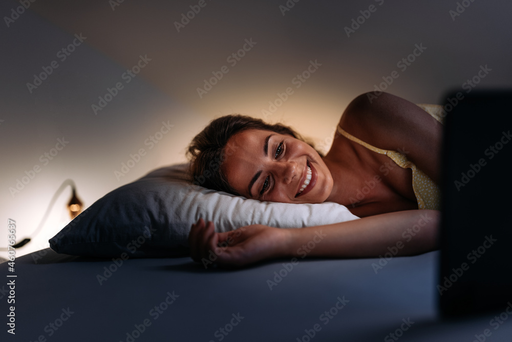 Adult woman, testing if the bed is comfortable.