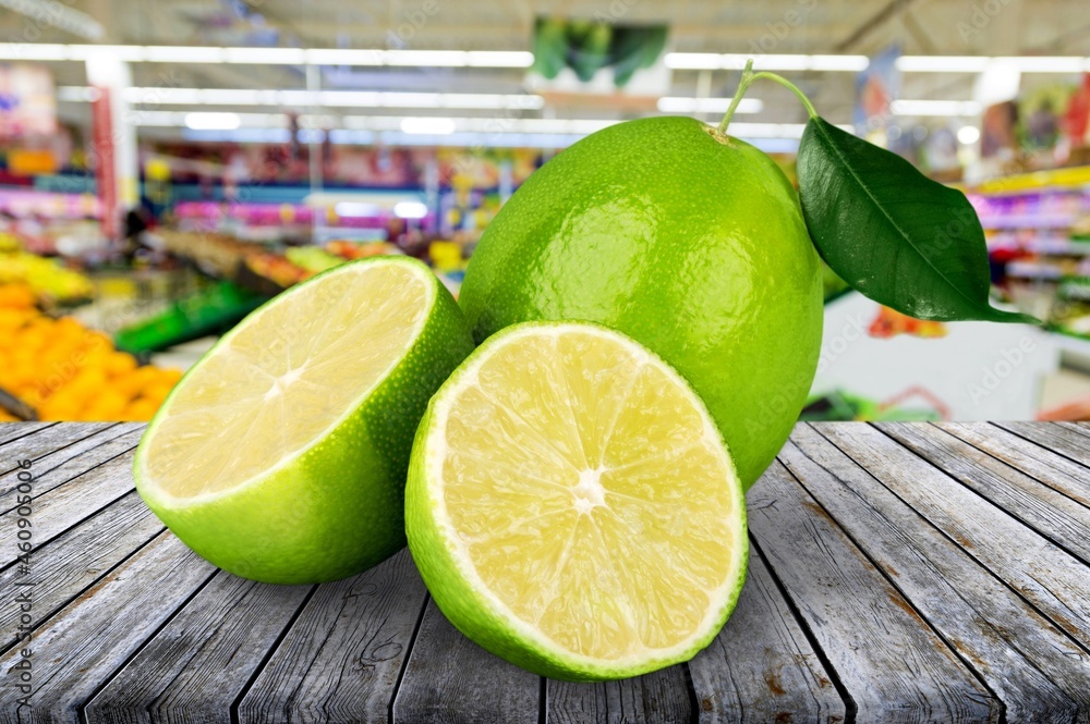 Fresh ripe juicy citrus lemon with slices and green leaf