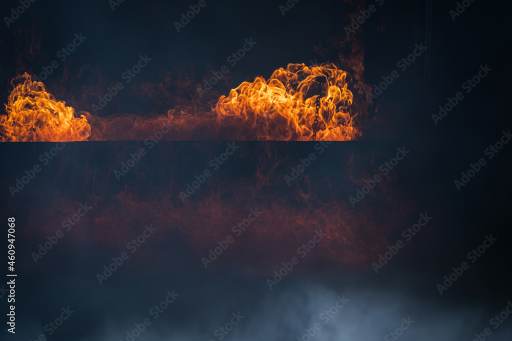 Burning red hot sparks rise from large fire,Beautiful abstract background on the theme of fire,Fire 