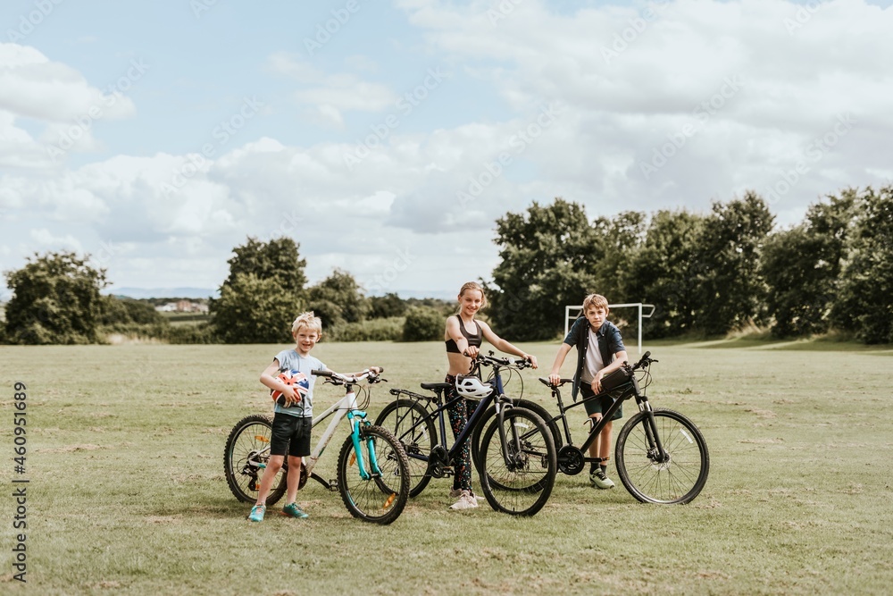 Summer hobby background, kids on bikes, family photos