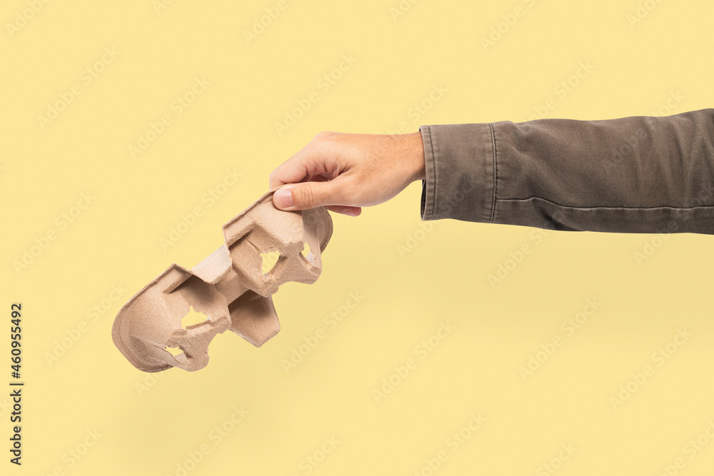 Disposable coffee holder held by a hand for environment campaign