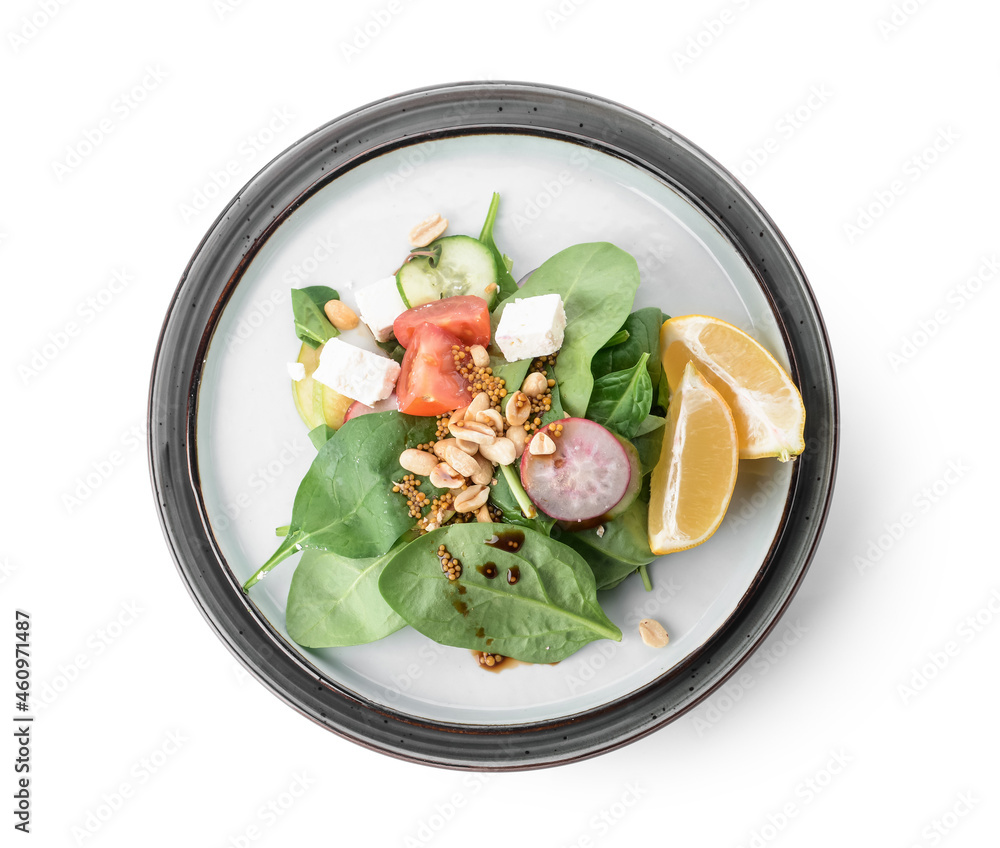 Plate with healthy salad and peanuts on white background