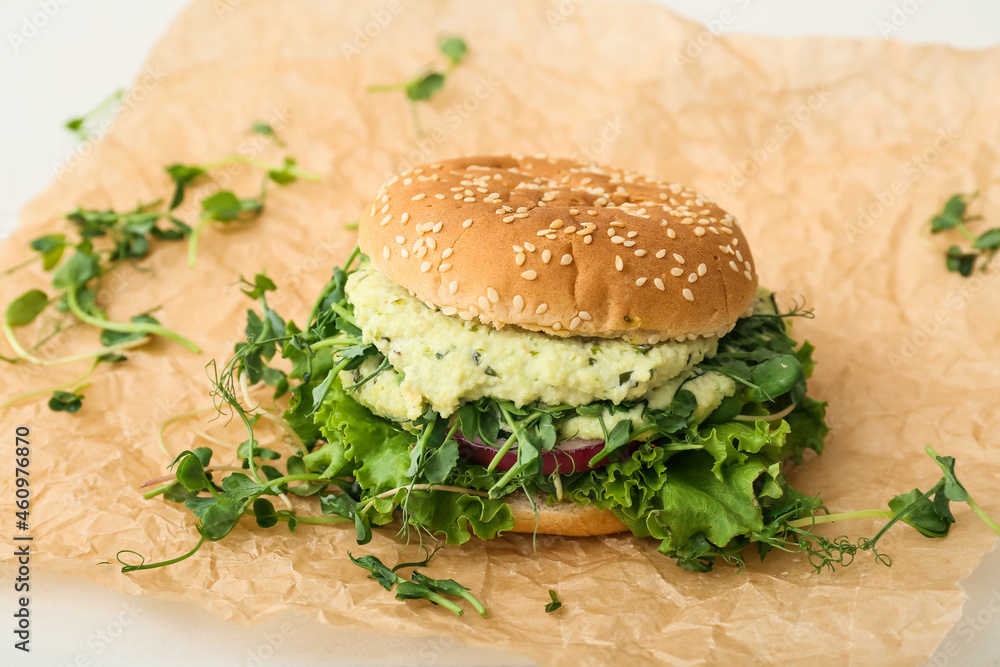 Tasty vegetarian burger on white background