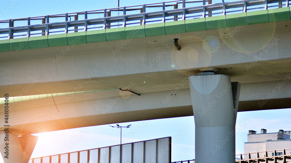 Bridge against the blue sky. Motorway flyover. Elevated roads on sunny day.