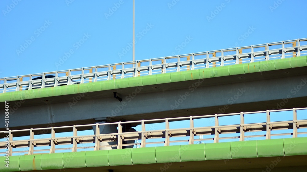 Bridge against the blue sky. Motorway flyover. Elevated roads on sunny day.