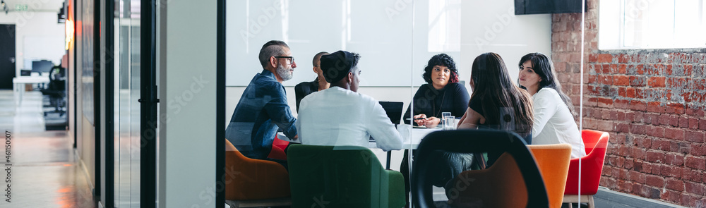 Team of colleagues having an important meeting in an office