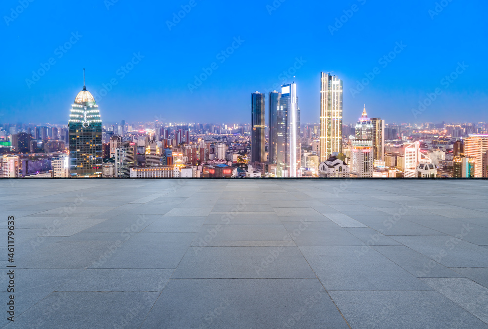 empty brick floor with city skyline background