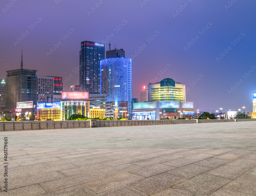 empty brick floor with city skyline background