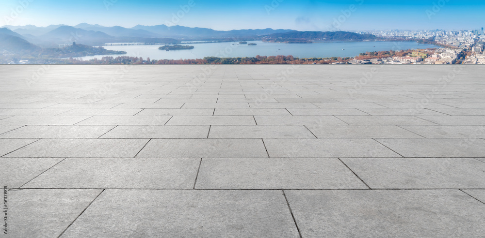 empty brick floor with city skyline background