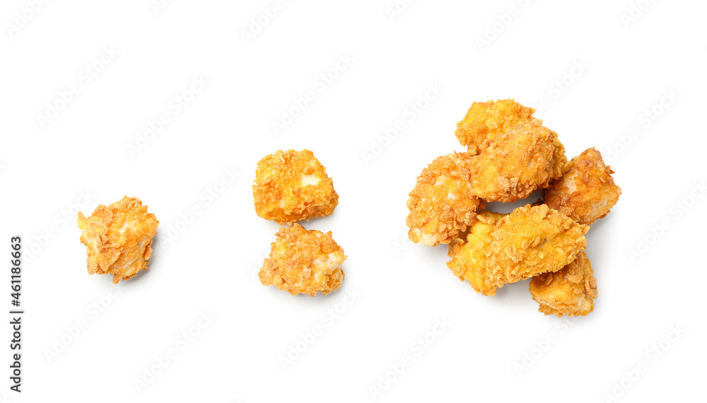 Crunchy popcorn chicken on white background