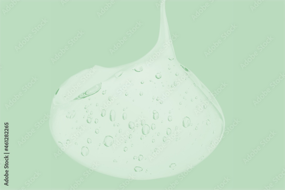 Liquid gel cosmetic smudge drops texture sage background