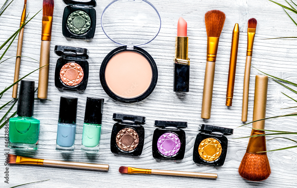 make up set with decorative cosmetics on woman table background top view