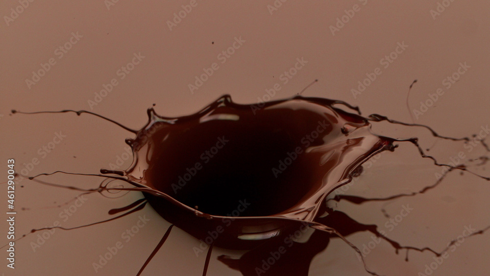 Macro photo of premium dark chocolate splash.