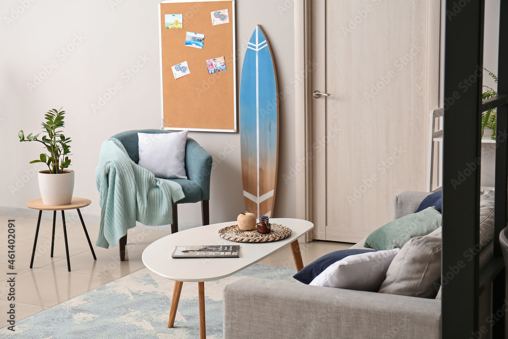 Interior of stylish room with surfboard