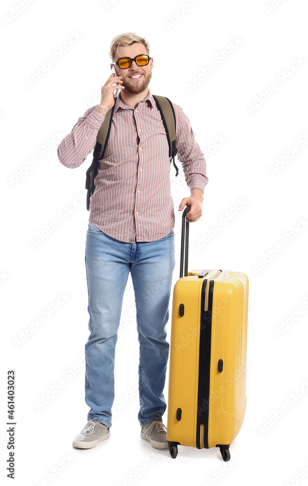 Male tourist talking by phone on white background