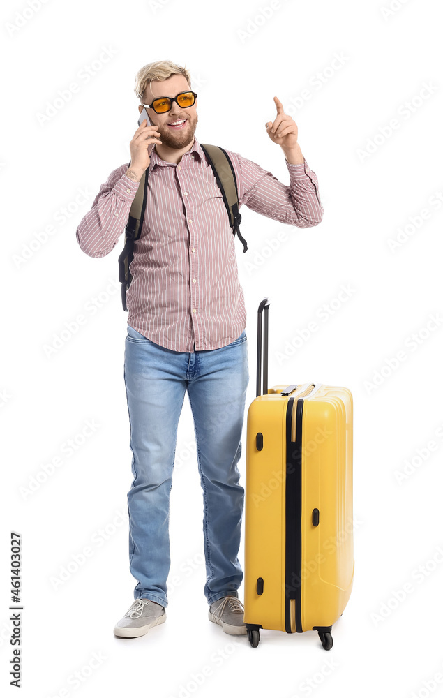 Male tourist talking by phone on white background