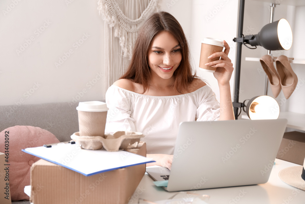 Female business owner working in shop