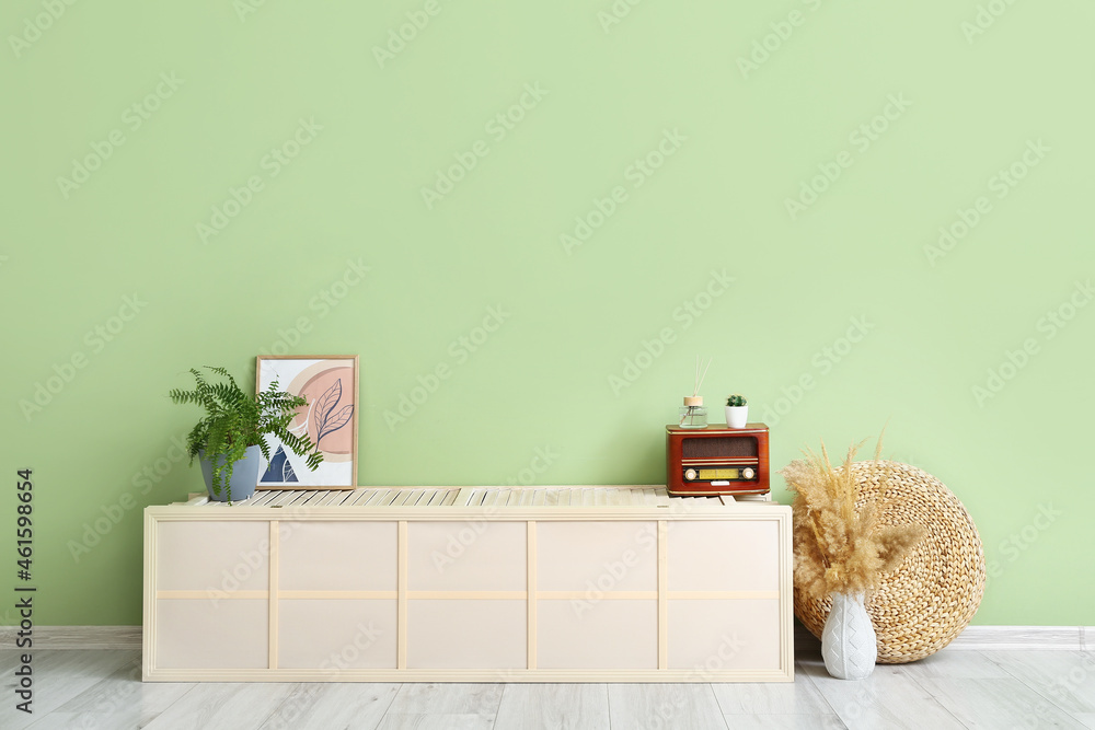 Interior of stylish modern room with green wall