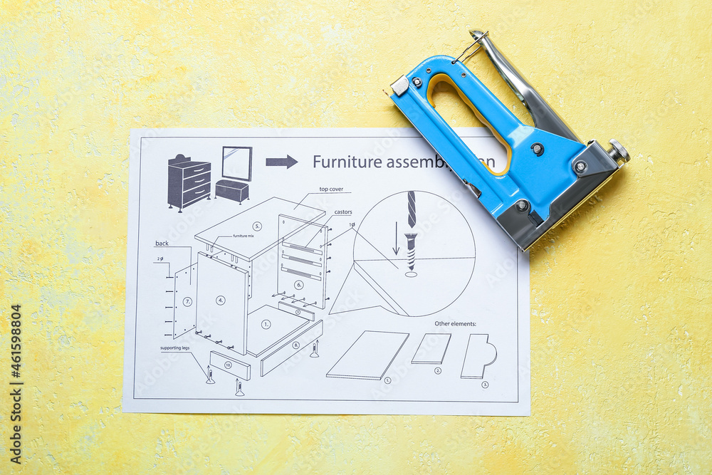 彩色背景上的家具组装平面图和订书机