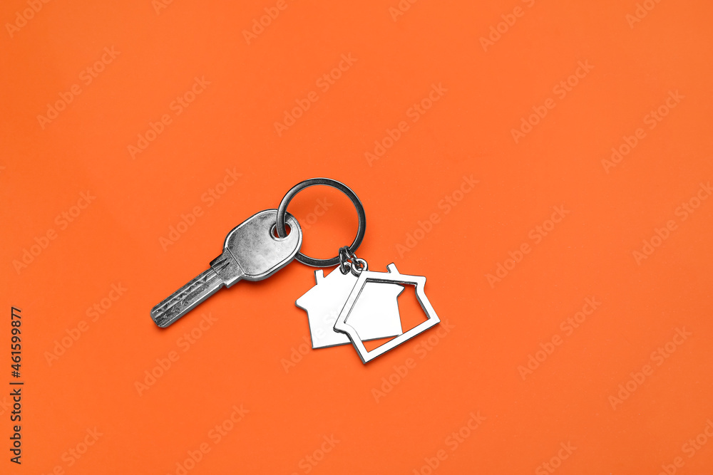 Key with keychain on orange background