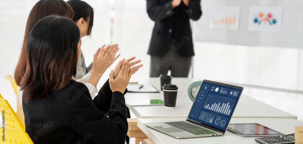 Businesswoman in business meeting using laptop computer proficiently at office for marketing data an