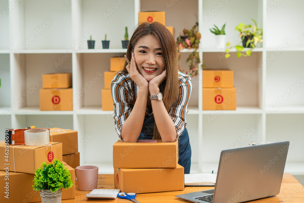 Small Business SME entrepreneur of Young Asian women working with laptop for Online shopping at home