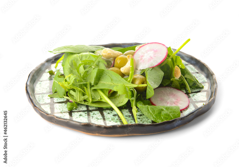 Plate with healthy salad and cashew nuts on white background