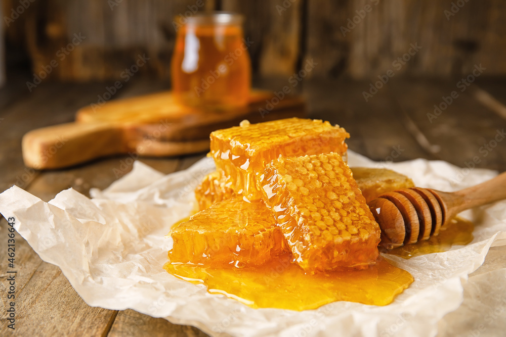 Honey combs on wooden background