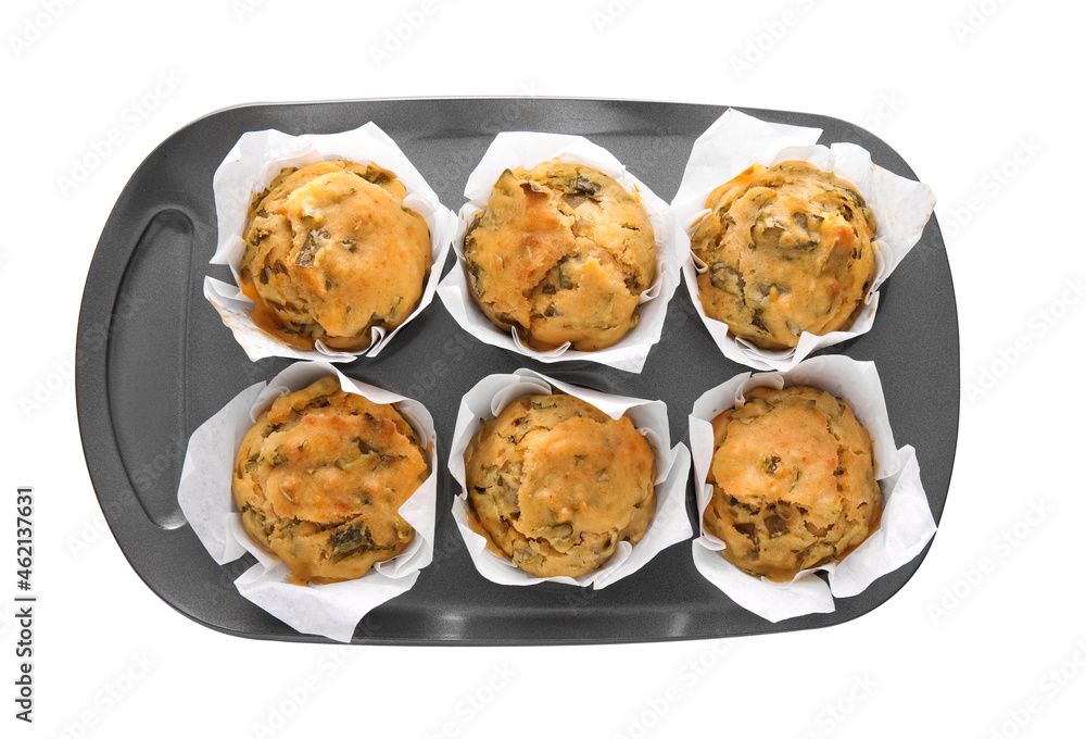 Baking tin with tasty spinach muffins on white background