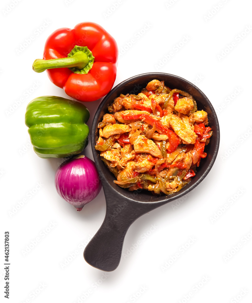 Frying pan with delicious traditional Mexican chicken Fajita on white background