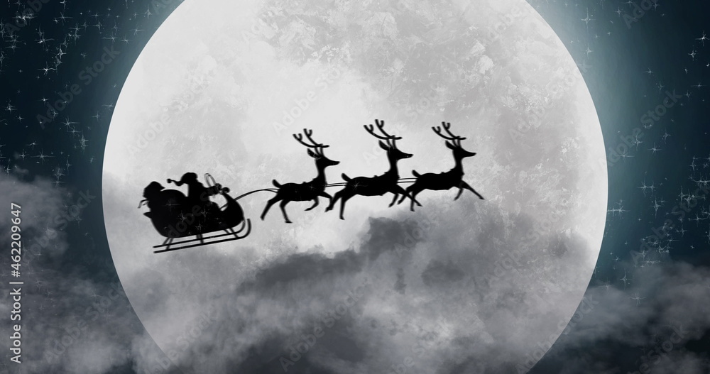 Silhouette of Santa Claus in sleigh being pulled by reindeers against moon